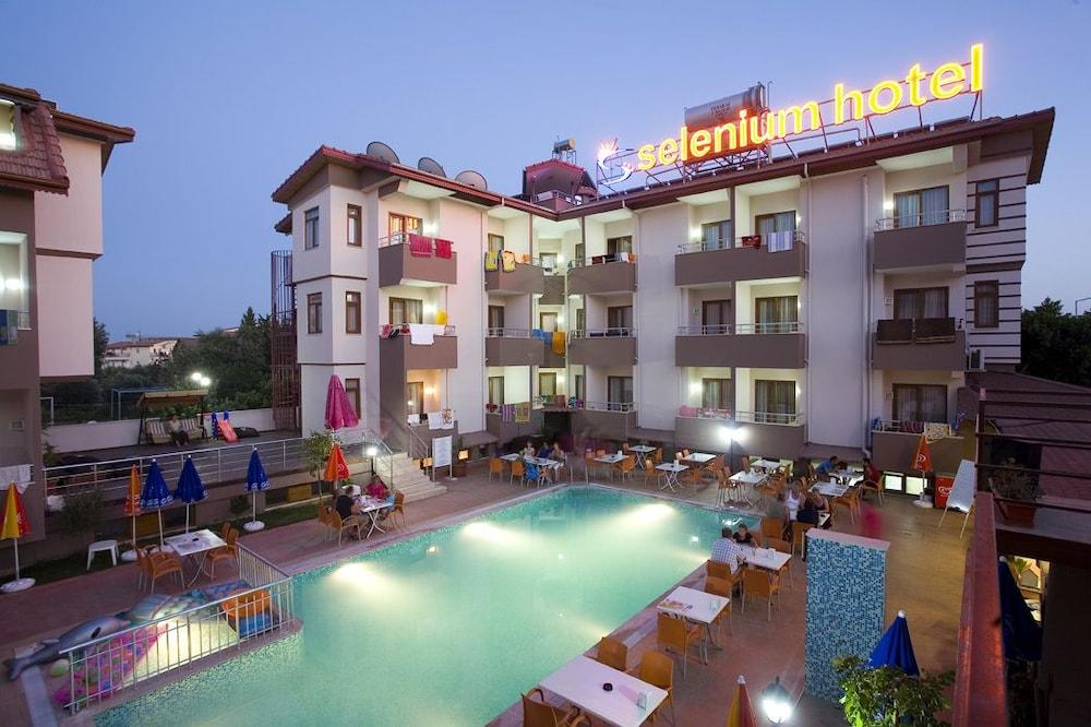 SELENIUM HOTEL — SIDE